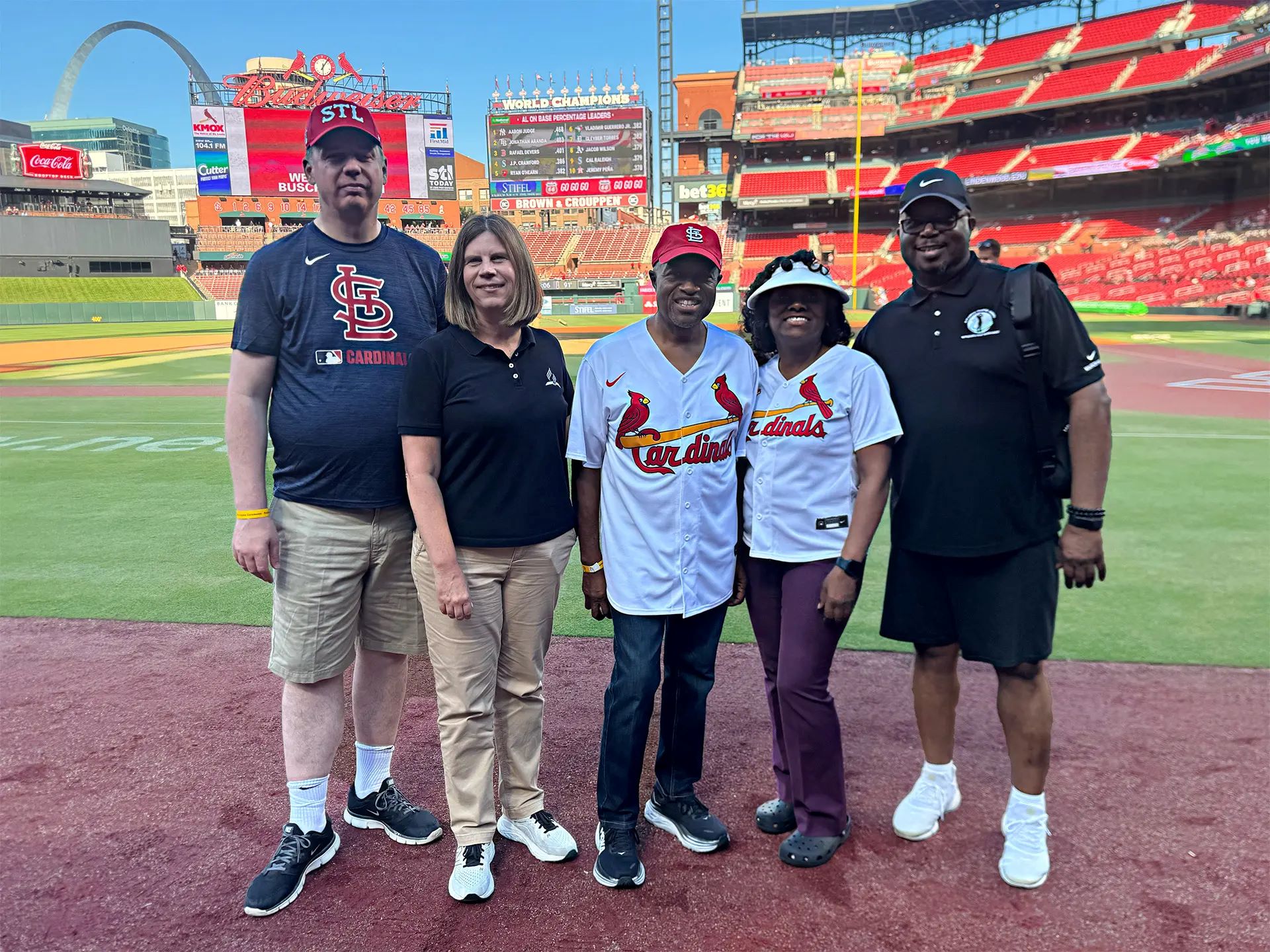 Left to right: Todd McFarland, General Conference deputy general counsel; Melissa Reid, an associate director for NAD Public Affairs and Religious Liberty (PARL); G. Alexander Bryant, NAD president; Desiree Bryant, an associate director for NAD Ministerial Association; and Orlan Johnson, NAD PARL director, pose for a photo before Bryant throws the first pitch on July 10, 2025.
